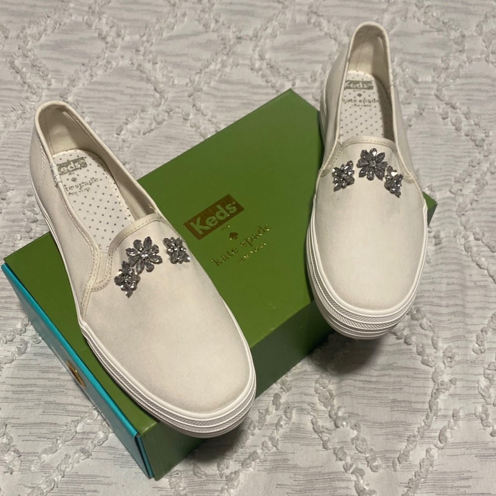 Cream color canvas slip on sneaker with jeweled front